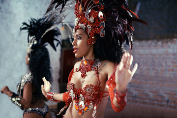 The main attraction. two beautiful samba dancers performing in a carnival.