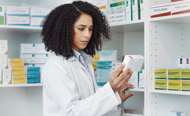 Pharmacy, medicine and retail with woman in store for healthcare, drug dispensary and treatment prescription. Medical, pills and shopping with pharmacist for check, label information or product