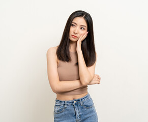 Upset confused bad emotional asian woman. Unhappy stressed female. Young lady standing feeling depressed dramatic scene on isolated background.