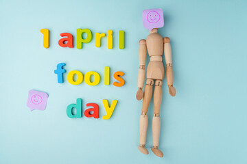 1 April fools day concept, blue background. Flat lay