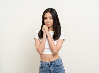 Beautiful smiling happy young asian woman age around 25 in white shirt. Charming female lady standing pose on isolated white background. Asian cute people looking camera confident with backdrop.