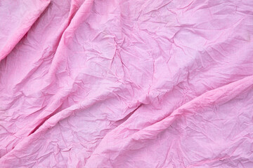 (Несколько значений)Pink crumpled fabric as a background.