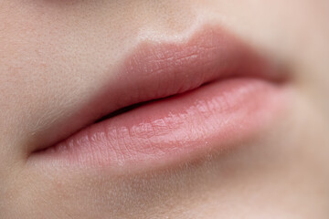 Fototapeta premium The lips of a young girl as a background.