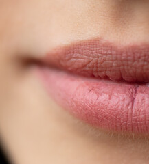 Fototapeta premium The lips of a young girl as a background.