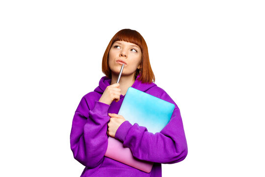 Young woman holding a laptop and thinking