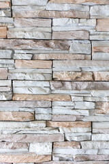 Modern and stylish various colored brick pattern textures are regularly listed and stacked with a pile of stone material background