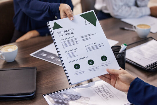 Hands, documents and design proposal by business people in meeting for creative collaboration. Hand, paper and form by woman designer with idea for marketing partnership on innovation or mission