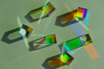 Top view of dispersion of artificial light, dichroic square glass cube scattering narrow beam of...