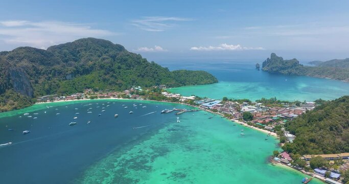 Aerial timelapse of PhiPhi Don islands Travel Landmark of Krabi, Thailand. Amazing Drone hyper lapse shot of Phi Phi island with beautiful blue turquoise tropical beach. Tourist attraction in summer.