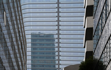 Modern skyscraper office buildings made of steel and glass. Corporation headquarters buildings industry.