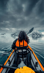 Female Kayaker Paddling Her Way Through Calm Waters of Antarctica, Woman in Orange Life Vest,...