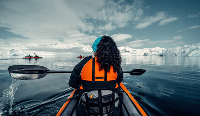 Female Kayaker Navigates Her Way Through Calm Waters of Antarctica, Woman in Orange Life Vest,...