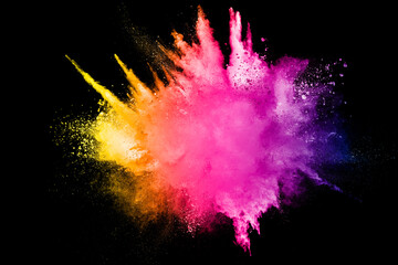 Colorful background of pastel powder explosion.Multi colored dust splash on black...