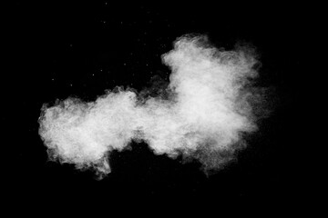 White dust cloud in the air.Abstract white powder explosion against black background.