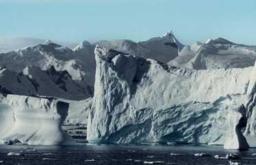 Mountainous Snow Covered Landscape in Antarctica, With Huge Icebergs