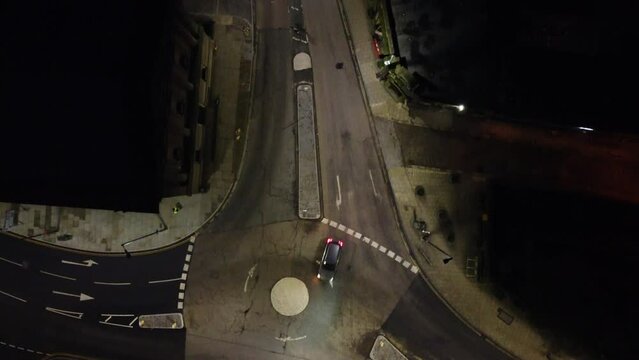 birds eye view of halifax road in todmorden in the evening , slow traffic , quiet roads , steady slow shot 