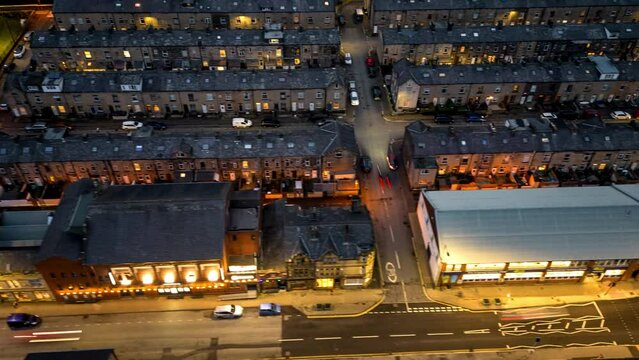 This hyperlapse is very fast moving and showcases halifax road in todmorden at night , sweeping along finishing with a shot of old terraced housing 