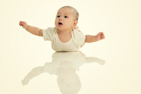 Lovely baby play prone on the floor