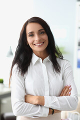 Portrait of smiling beautiful woman in white shirt.