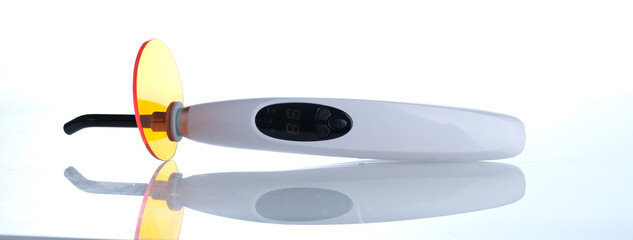 Dentist curing UV lamp closeup. Lamp for photopolymerization of dental materials