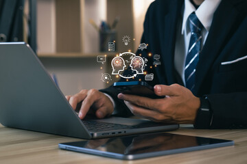 Businessman using chatbot in smartphone intelligence Ai. Chat with AI Artificial Intelligence, developed by OpenAI generate. Futuristic technology, robot in online system. Database smart chatbox.