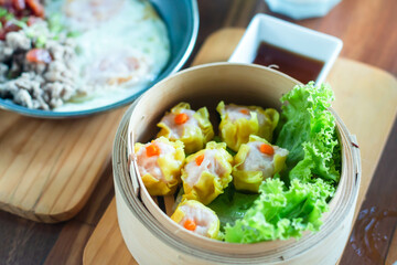 Chinese yellow steamed dumpling. Chinese Traditional cuisine concept. Dumplings Dim Sum in bamboo steamer  Asian food background