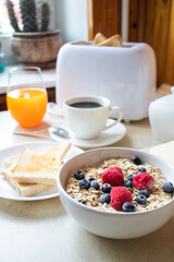Breakfast. Oatmeal, coffee, bread, butter. In the kitchen. Morning