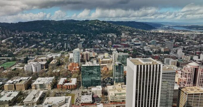 Portland Oregon Aerial v102 flyover downtown capturing urban cityscape with views of NW and SW hillside neighborhoods and thick stormy clouds covering the sky - Shot with Mavic 3 Cine - August 2022