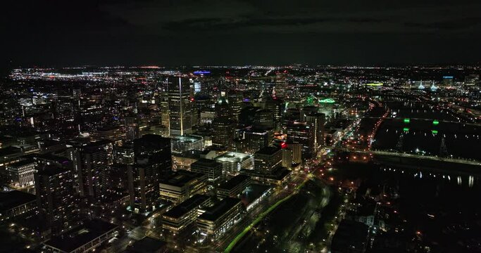 Portland Oregon Aerial v114 reverse flyover downtown capturing illuminated night cityscape, traffics on interstate highways and bridges across Willamette River - Shot with Mavic 3 Cine - August 2022