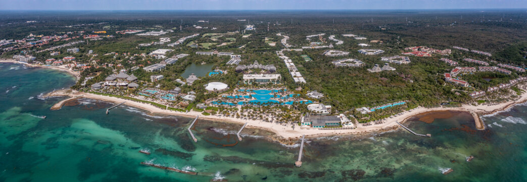 panoramic aerial landscape view of the area around Playa Paraiso in Riviera Maya, Cancun on Yucatan Peninsula in Mexico with white sand beaches and  hotel facilities during a sunny day	
