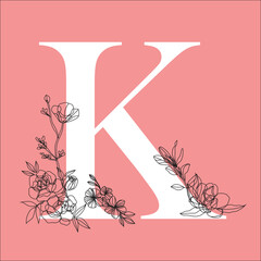 The letter K from the English alphabet is decorated with flowers in the form of a black line. 