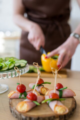 Cooking in the kitchen diet menu, healthy food, ready snacks delivery concept. Hands of the chef in the frame cutting vegetables