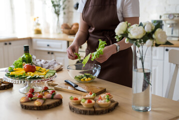 Cooking in the kitchen diet menu, healthy food, ready snacks. Chef's hands in the table setting frame.