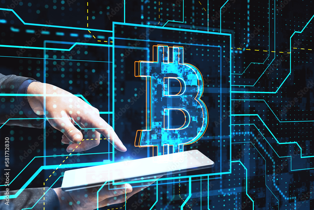 Poster close up of businessman hand using tablet with glowing circuit bitcoin hologram on dark background. 