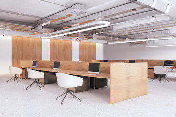 Contemporary wooden and concrete coworking office interior with furniture, equipment and other items. Workplace and commercial space concept. 3D Rendering.
