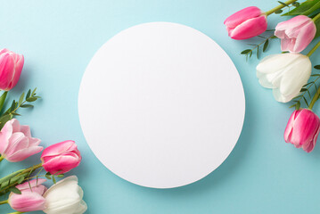 Mother's Day concept. Top view photo of white circle and bouquets of fresh tulips on isolated pastel blue background with empty space - obrazy, fototapety, plakaty