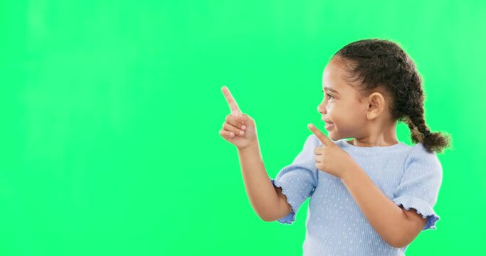 Happy, pointing and mockup with girl in studio for product placement, promotion and offer. Choice, launch and smile with portrait of child on green background for brand, advertisement and display