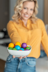 Fototapeta na wymiar Woman showing her colourful Easter eggs