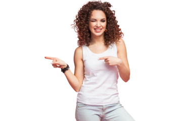 Photo of happy young woman standing isolated over transparent background. Looking camera showing copyspace pointing
