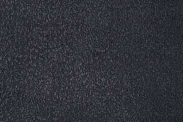 Fototapeta premium The texture of the black plastic ribbed surface for background