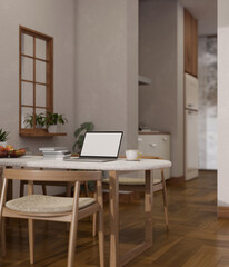 Home workplace, laptop mockup on dining table in beautiful cozy dining room.