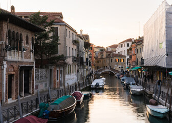 Fototapeta na wymiar A view of a canal and typical architecture in Venice, Italy, in the springtime 