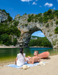 couple on vacation in the Ardeche France Pont d Arc, Ardeche France, view of Natural arch in Vallon...