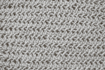Handmade knitted background with detail woven threads.