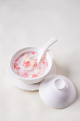 traditional ice cold chilled colourful fruit peach gum bo bo cha cha sweet soya bean coconut milk soup in white bowl on wood background sweet dessert halal menu