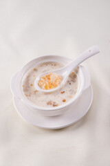 traditional ice cold chilled colourful fruit peach gum bo bo cha cha sweet soya bean coconut milk soup in white bowl on wood background sweet dessert halal menu