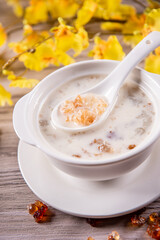 traditional ice cold chilled colourful fruit peach gum bo bo cha cha sweet soya bean coconut milk soup in white bowl on wood background sweet dessert halal menu