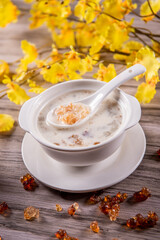 traditional ice cold chilled colourful fruit peach gum bo bo cha cha sweet soya bean coconut milk soup in white bowl on wood background sweet dessert halal menu