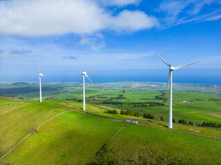 Aerial view of the wind turbine on the beautiful green Terceira Island of Azores Archipelago, in Atlantic Ocean, Portugal. © Curioso.Photography