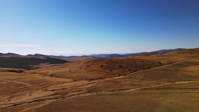 aerial panoramic view during a sunny summer day of pietra arsa mountains peak in Romania 